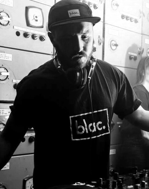 Jack Barton DJing, in black and white
