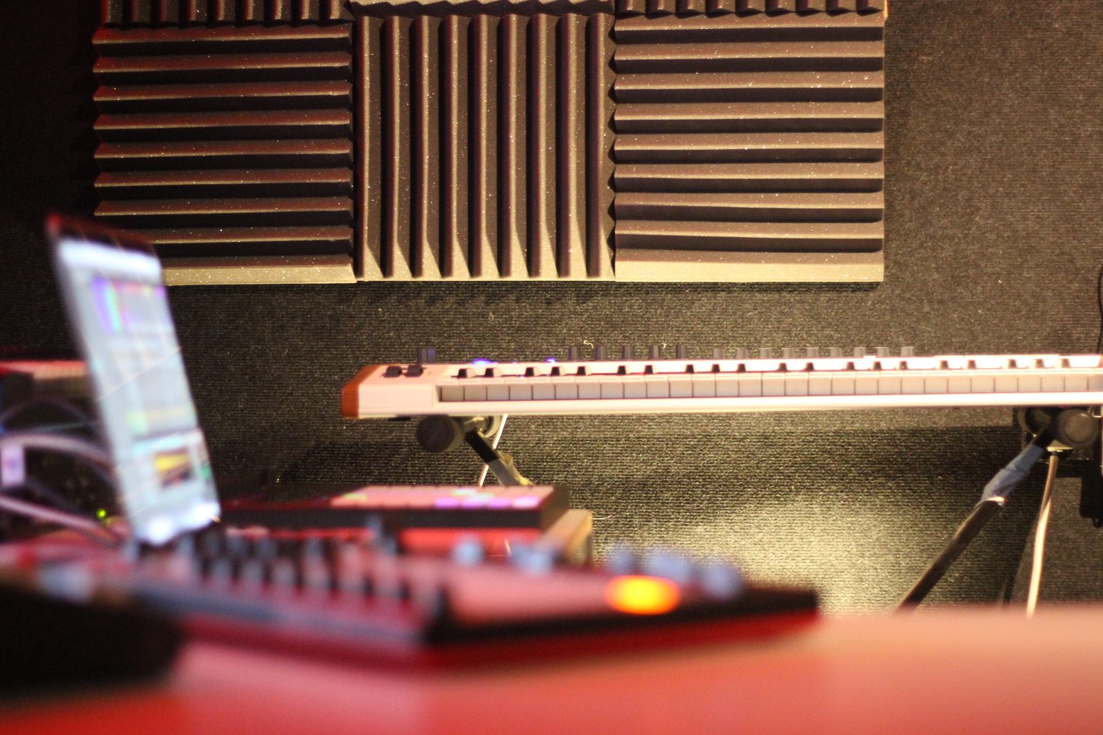 Close-up of mixer knobs and faders in a music studio